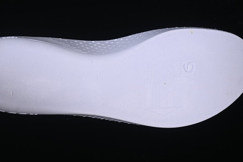 Close-up of the shoe insole with a size and manufacturing information panel