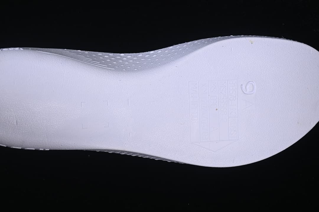 Close-up of the shoe insole with a size and manufacturing information panel