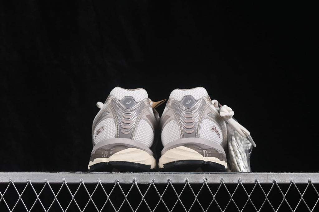 Rear view of the pair showing the padded collars, heel overlays, and ASICS branding.