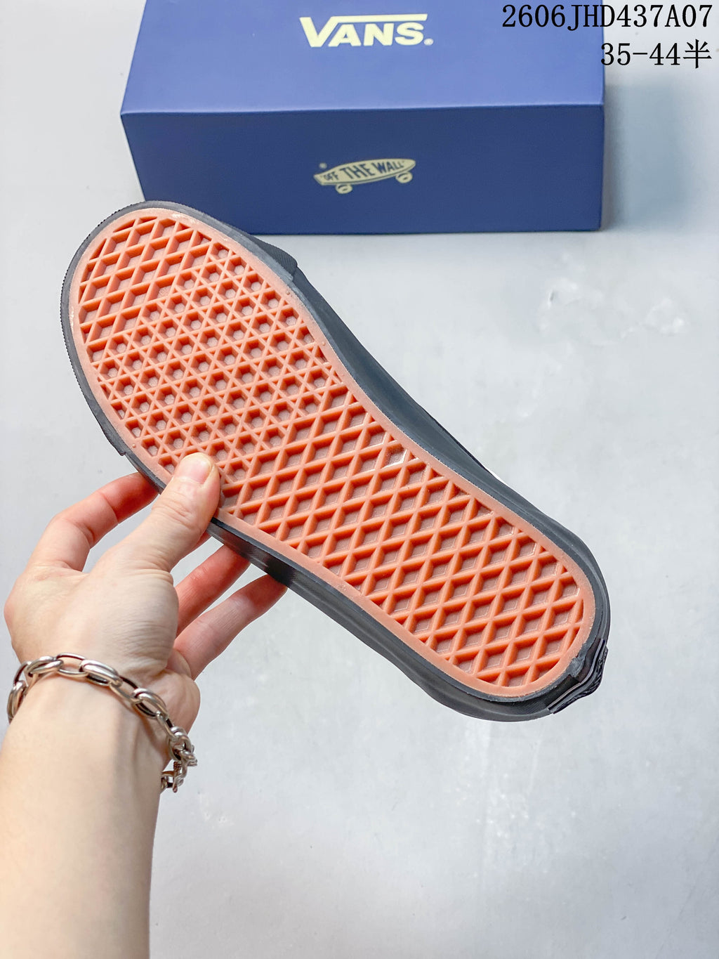 Close-up of the sneaker outsole showing a waffle-pattern tread.