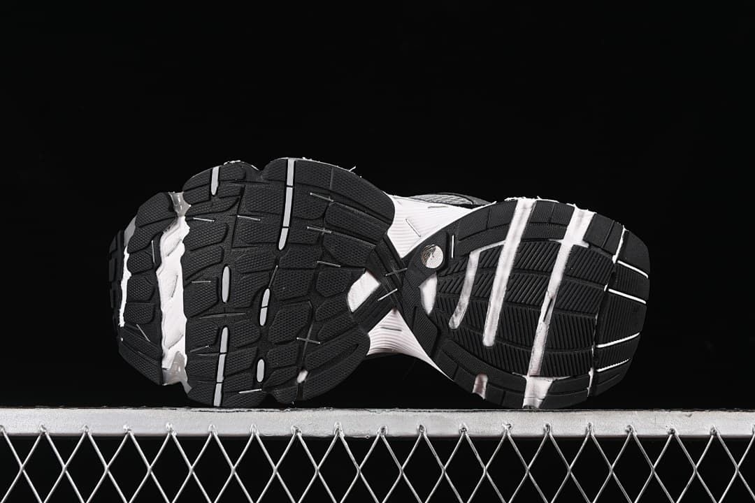 Underside view showing the black tread pattern and white sole sections