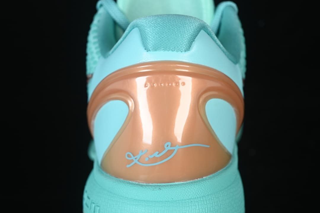 Rear view showing the copper-toned heel panel and signature detail.