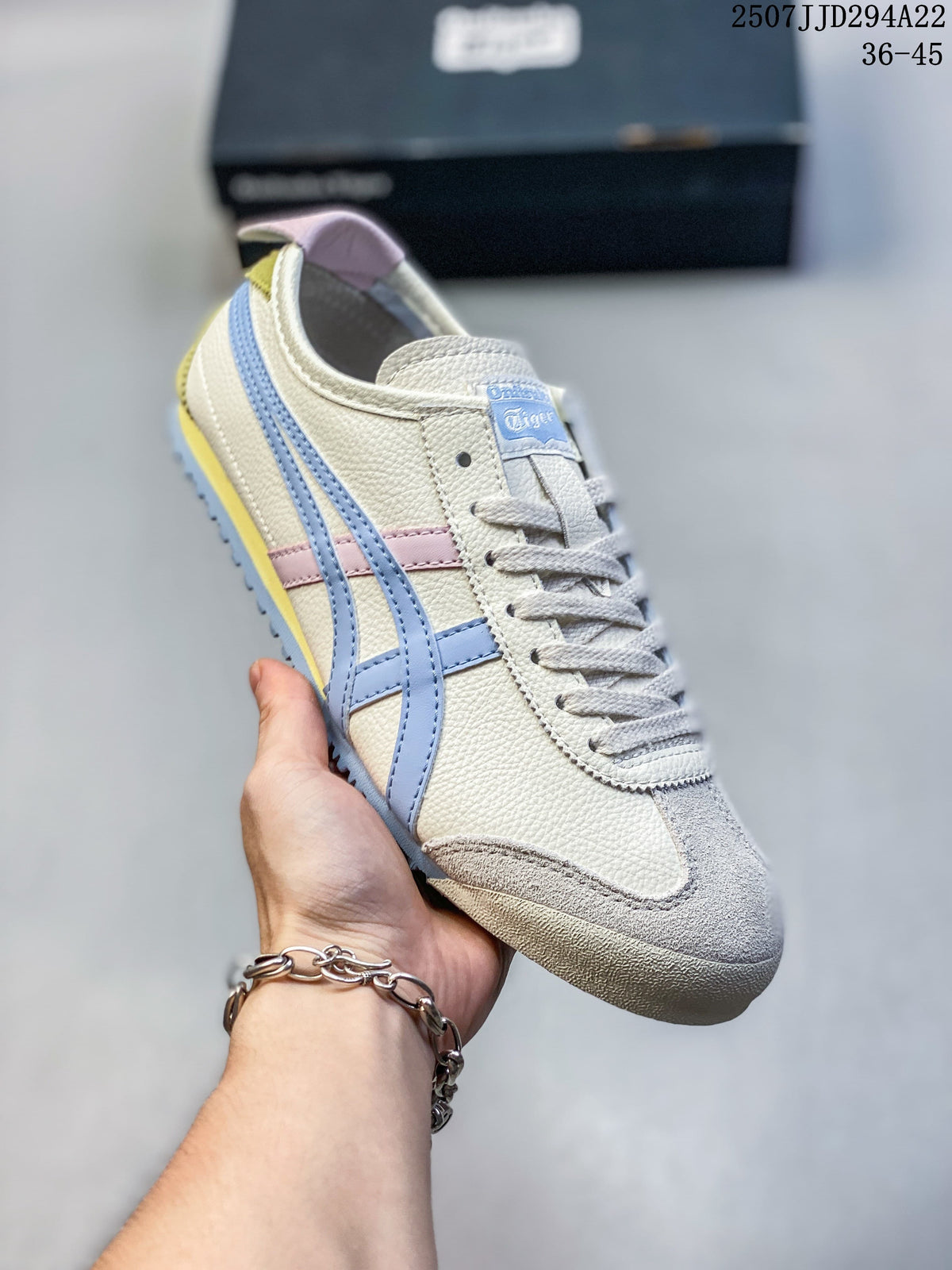 Angled close-up of the sneaker showing its cream upper, blue side stripes and suede-look toe overlay.