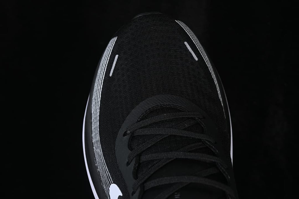 Top view of the black shoe toe and lacing