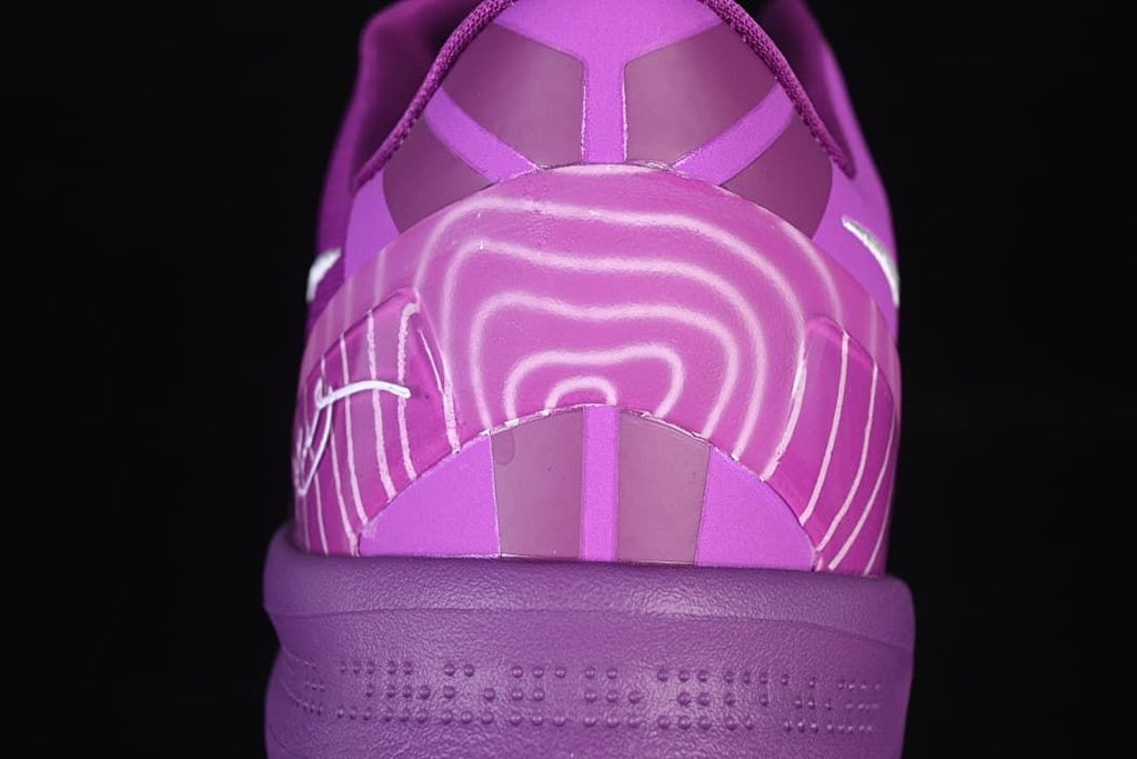 Rear view showing the purple heel counter and decorative line details