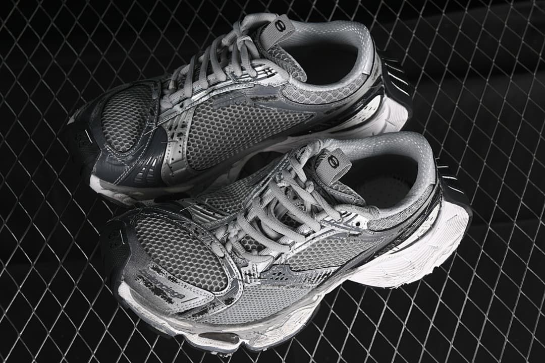 Pair of grey and silver sneakers shown from above at an angle