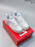 Pair of white Diesel S-Ukyo V2 low-top sneakers displayed on a red shoe box.