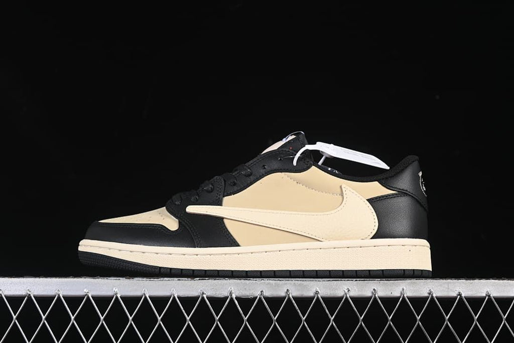 Side profile of a black and sail low-top Air Jordan 1