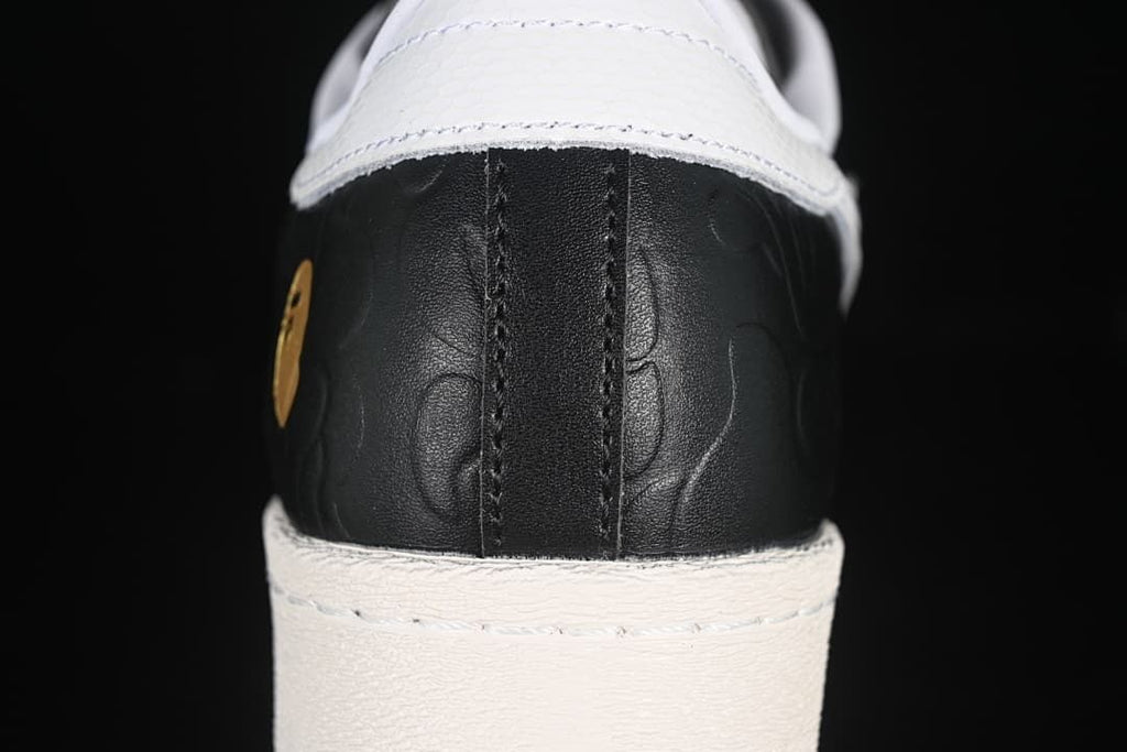 Rear close-up of the black embossed heel and white heel tab