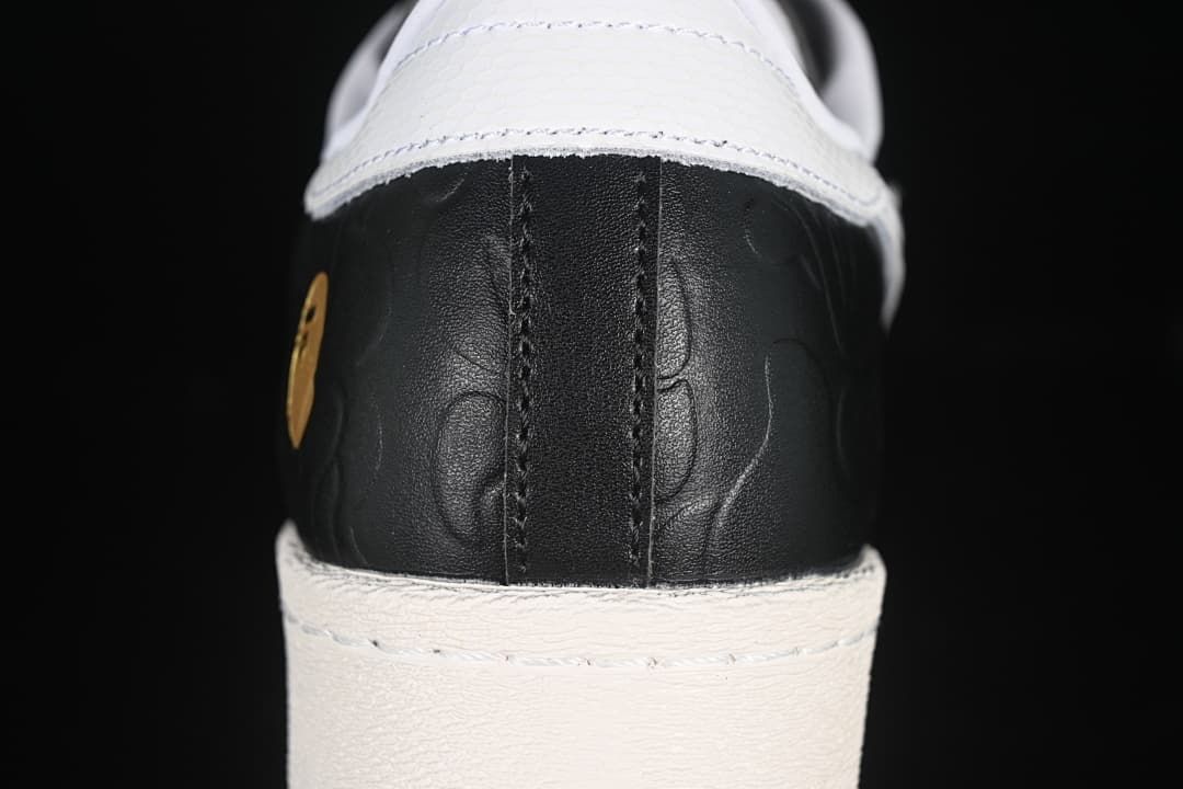 Rear close-up of the black embossed heel and white heel tab