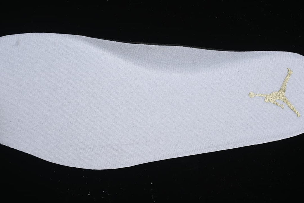 Close-up of the white insole with a gold Jumpman logo