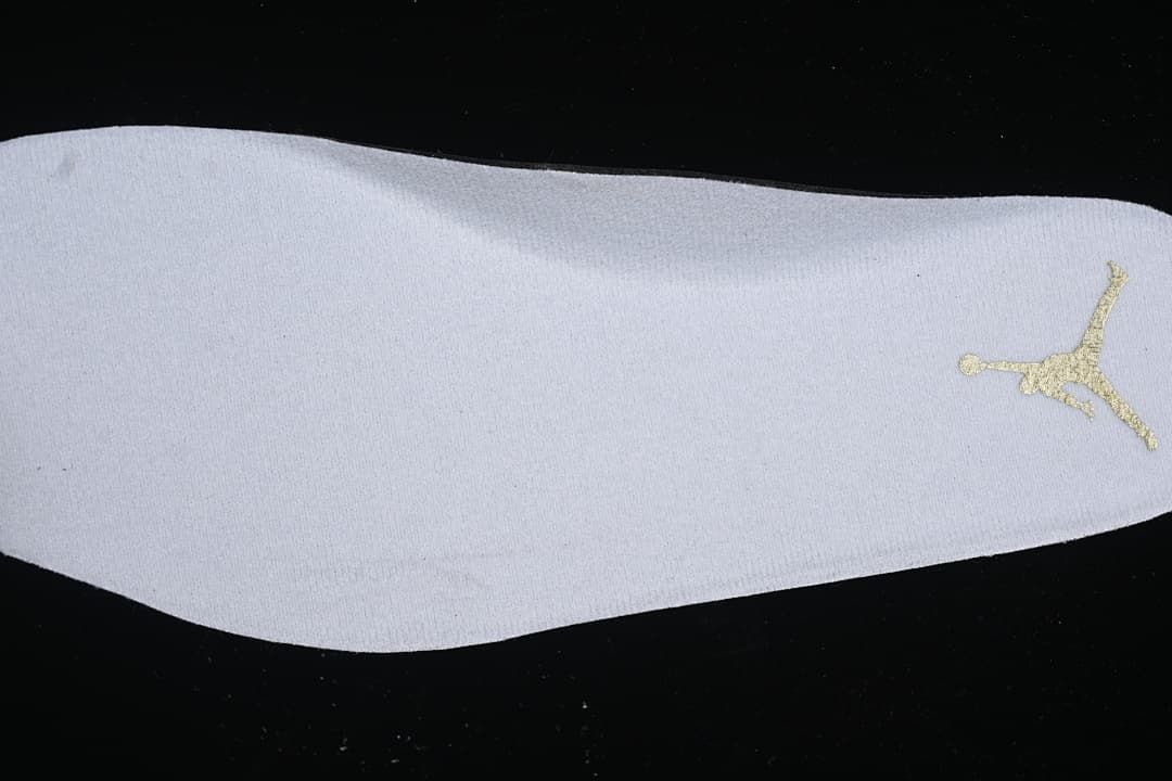 Close-up of the white insole with a gold Jumpman logo