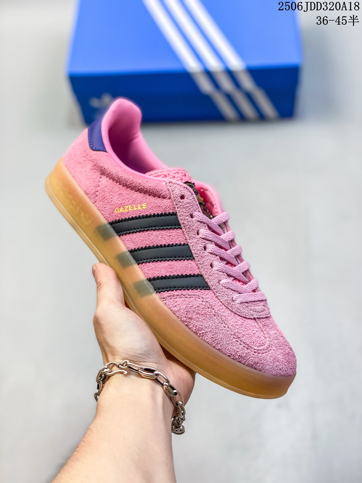 Angled side view of the pink Gazelle sneaker with visible model lettering
