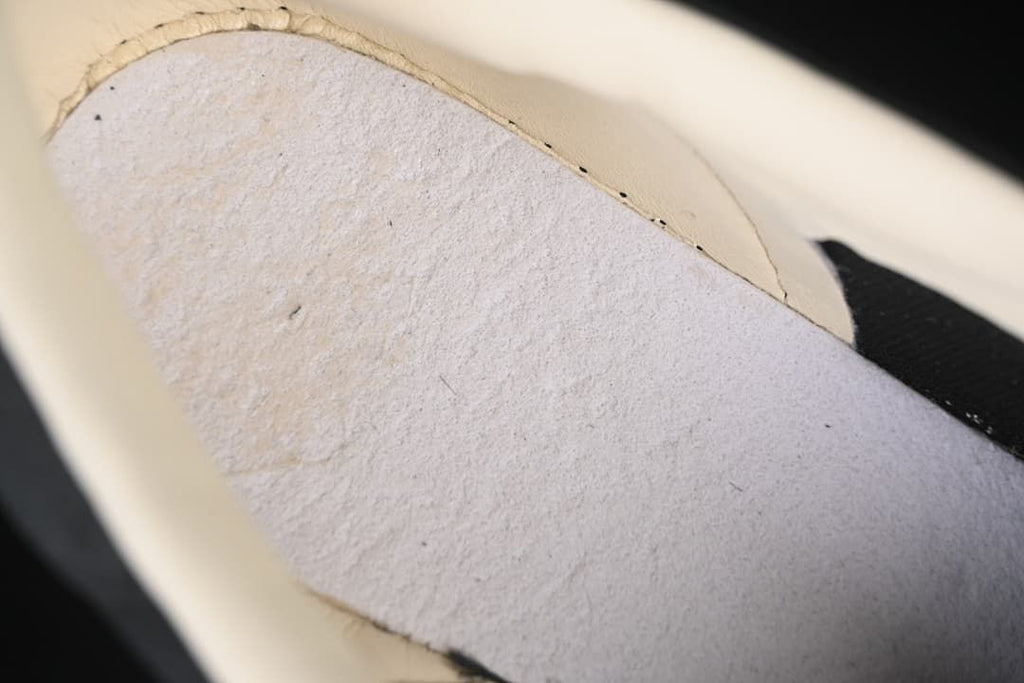 Close-up of the interior lining and inner construction of the sneaker.
