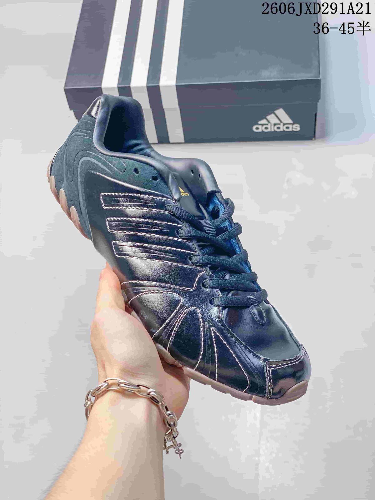 Gray-toned adidas Ghost Sprint sneaker with a contrasting darker sole.