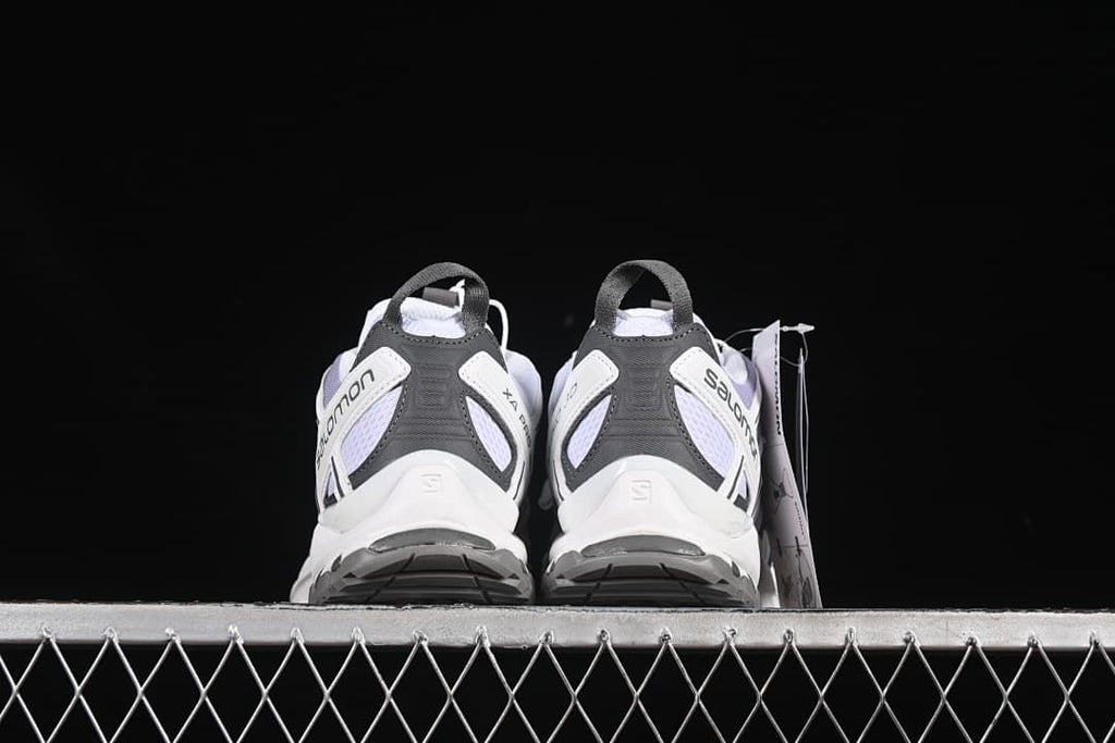 Rear view of the pair showing heel structure and outsole edges