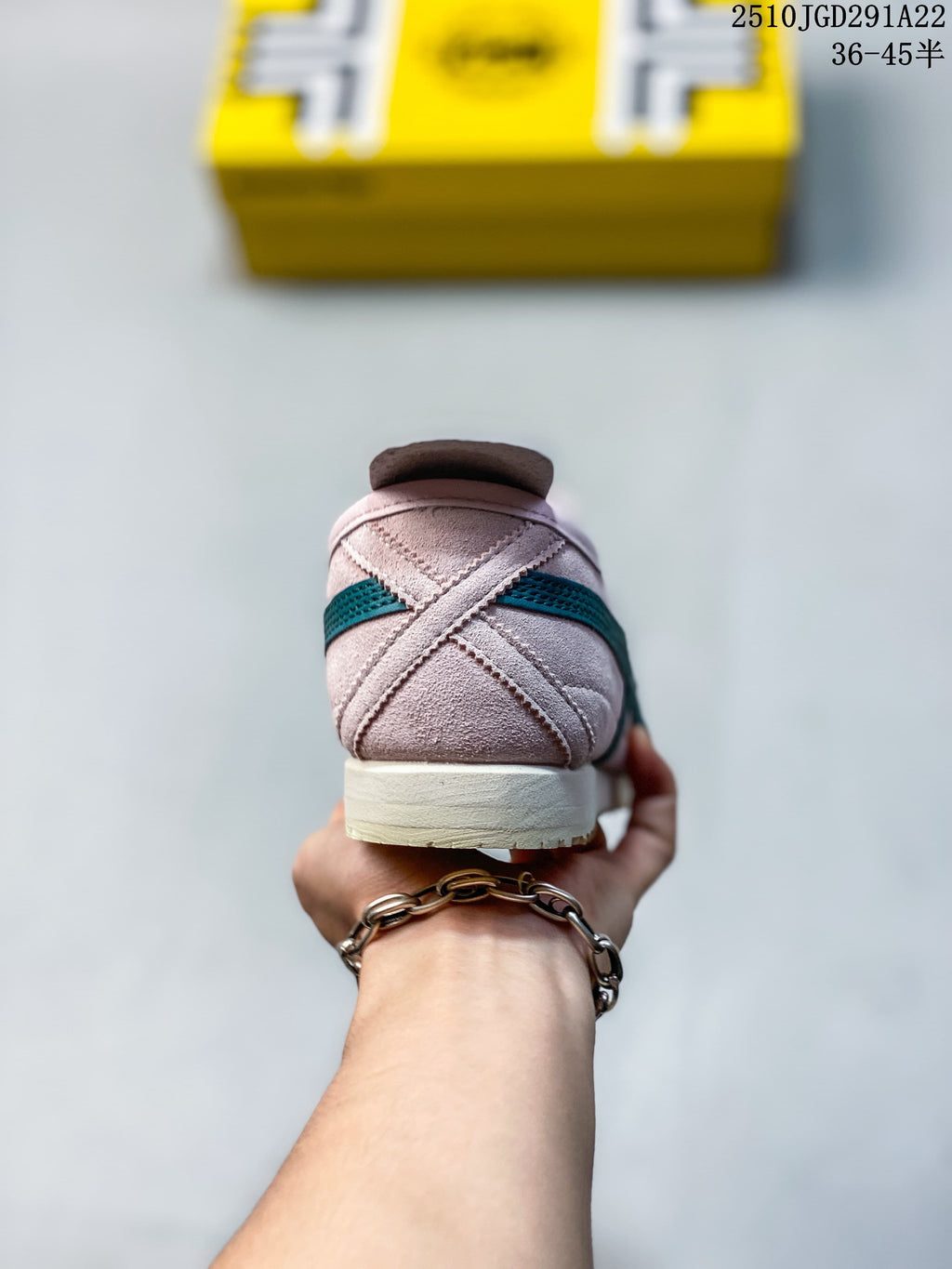 Rear view showing the pink heel, teal stripe, and light-colored outsole