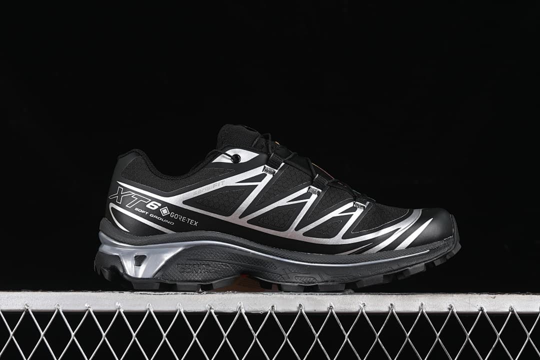 Side profile of the black and silver Salomon XT-6 GTX shoe.