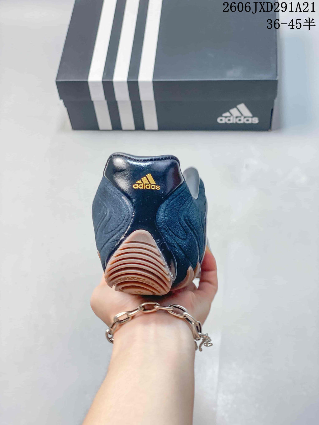 Rear view showing the heel and outsole of a navy Ghost Sprint sneaker