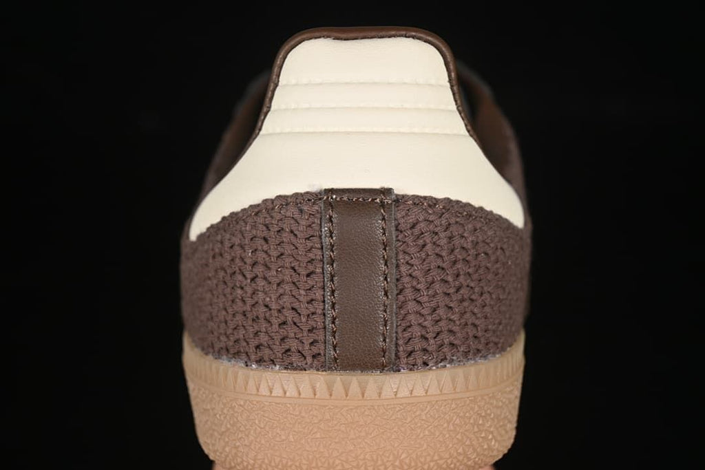 Rear view showing the brown knit-textured heel, light heel panel and gum outsole