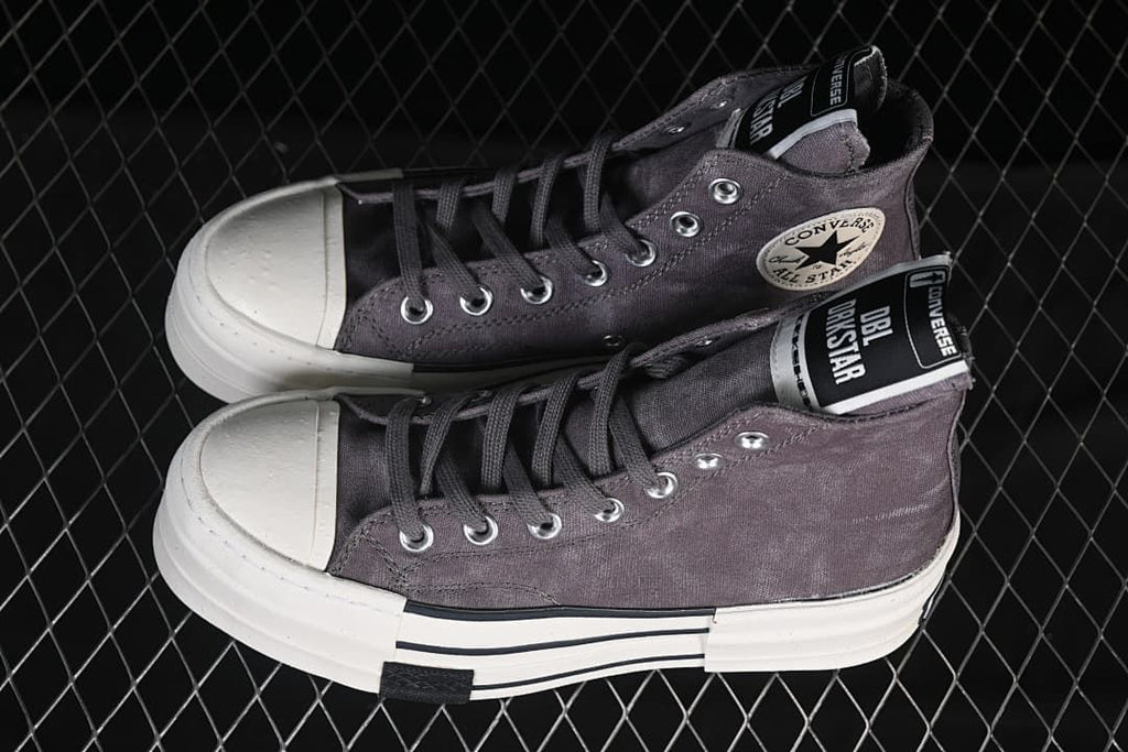 Pair of gray high-top platform sneakers shown from above and the side.
