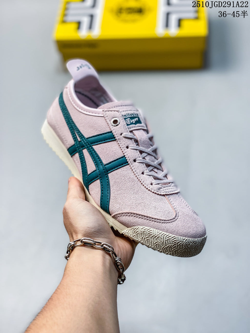 Angled side view highlighting the pink upper, teal stripes, laces, and textured outsole