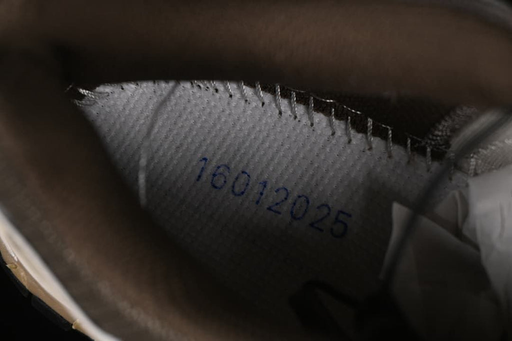 Close-up inside the shoe showing a printed date marking.