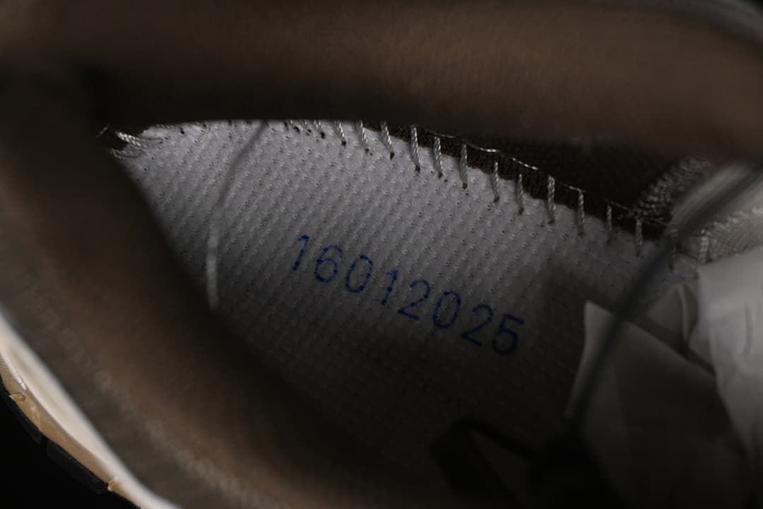 Close-up inside the shoe showing a printed date marking.
