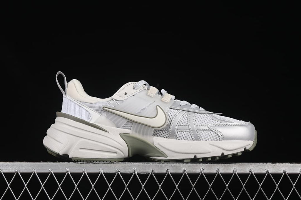 Side profile of a Nike V2K Run sneaker in white, grey and muted olive