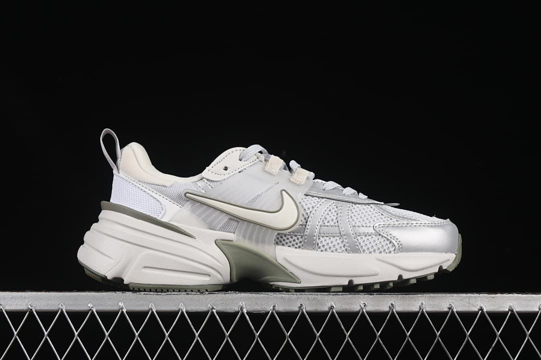 Side profile of a Nike V2K Run sneaker in white, grey and muted olive