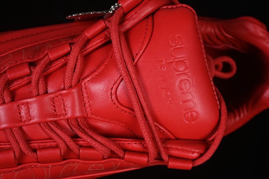 Close-up of Supreme branding on the tongue and lace details