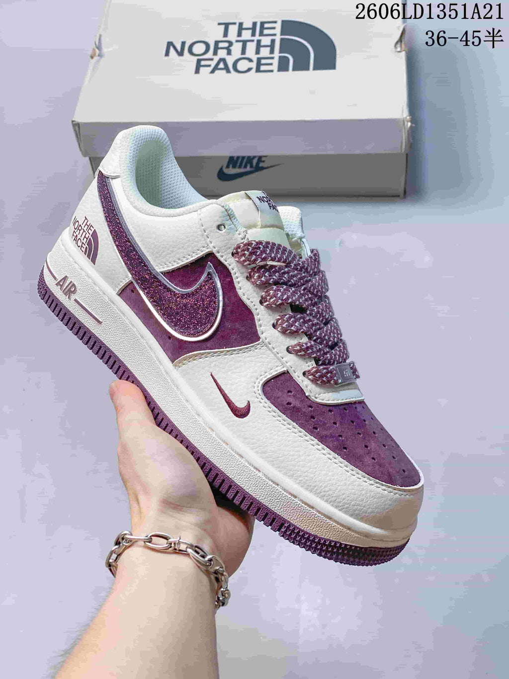White low-top sneaker with purple glitter Swoosh and plum accents
