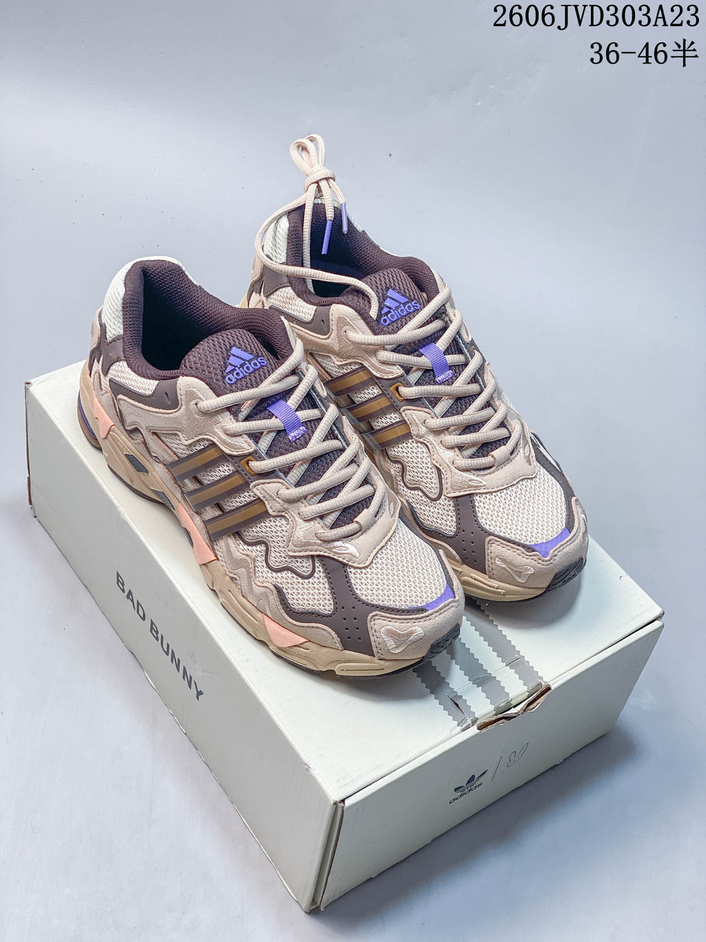Beige and brown adidas Response CL sneakers with purple accents on a Bad Bunny-branded box