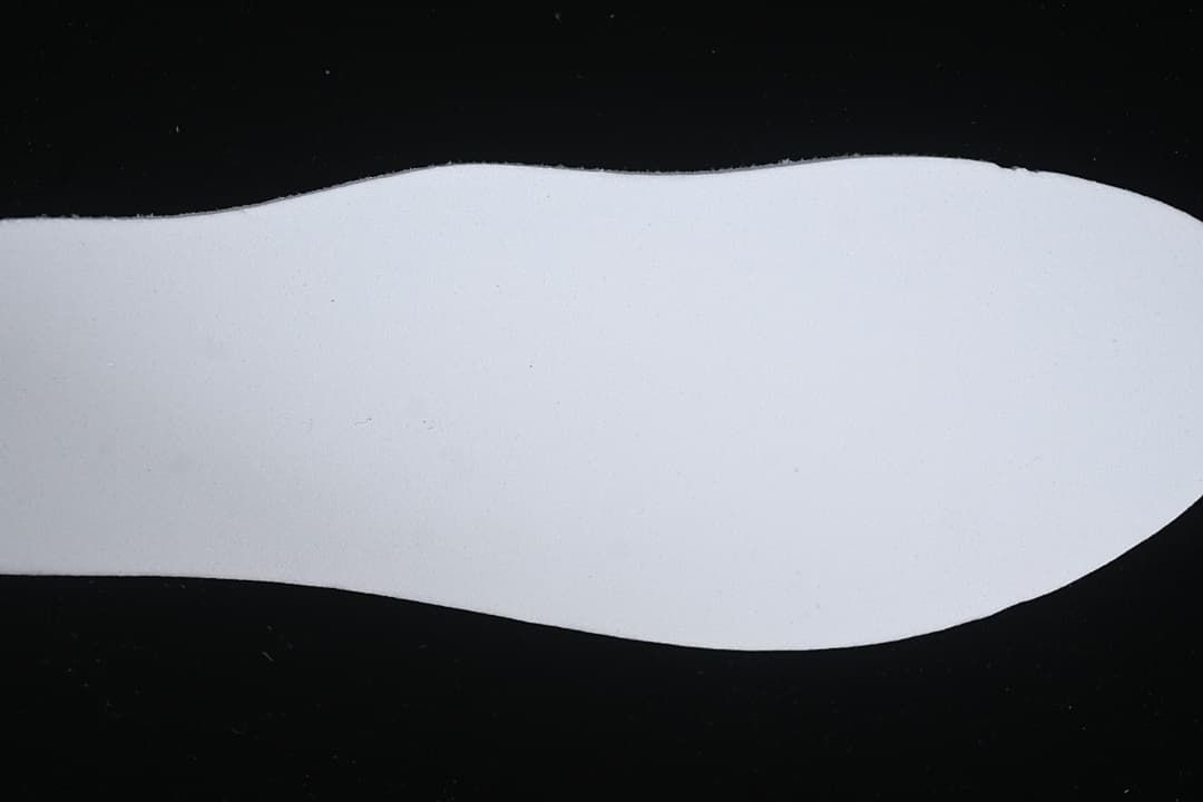 Close-up view of a white sneaker midsole.