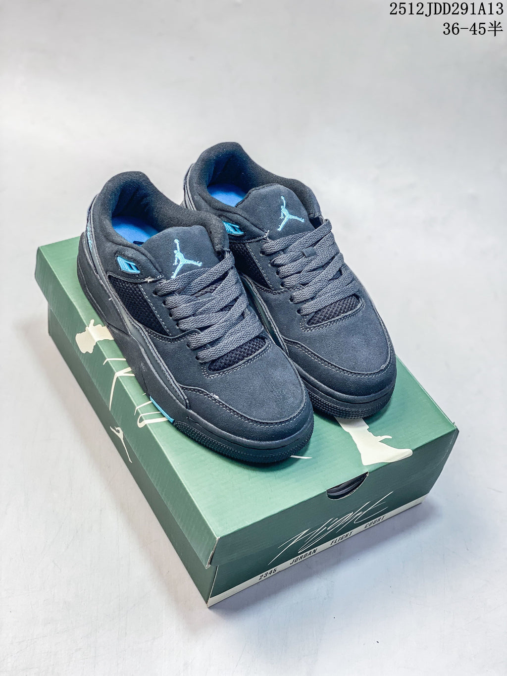 Pair of dark charcoal Jordan Flight Court ATE low-top sneakers with blue accents displayed on a green shoe box