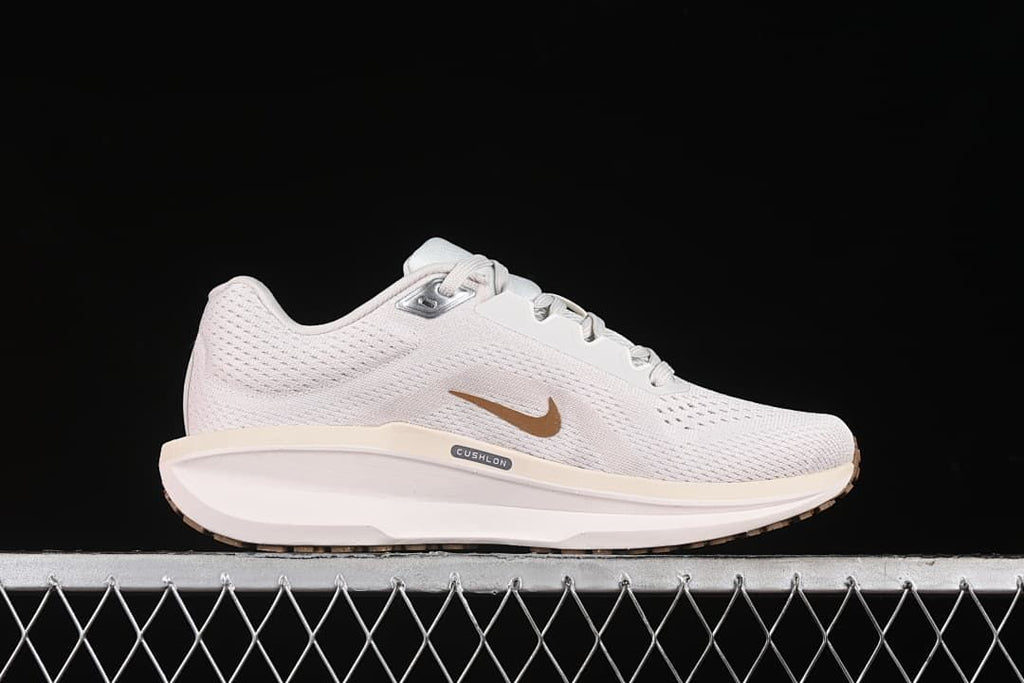 Side profile highlighting the midsole and gold-tone Swoosh.