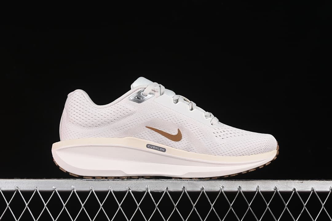 Side profile highlighting the midsole and gold-tone Swoosh.