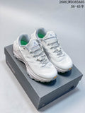 White KAILAS Fuga Ex3 trail running shoes with dial-adjustable laces on a shoebox