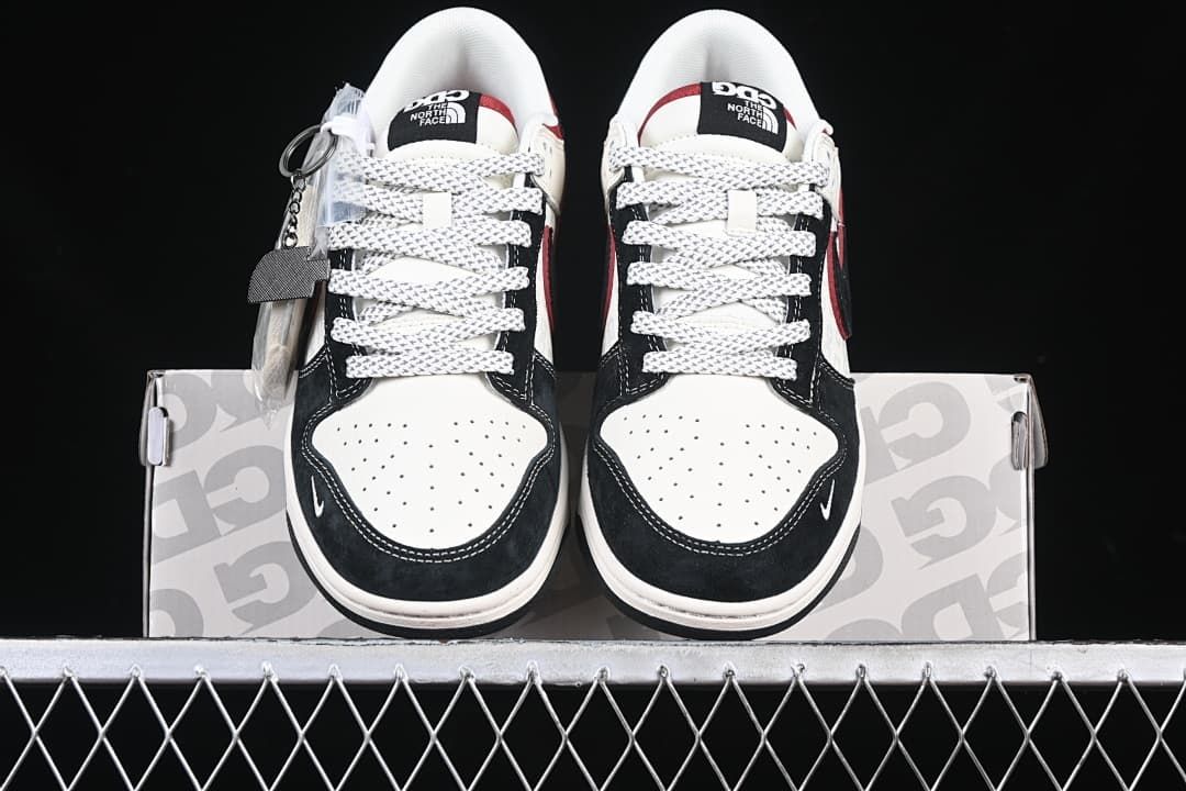 Front view of the pair showing perforated toe panels and patterned laces
