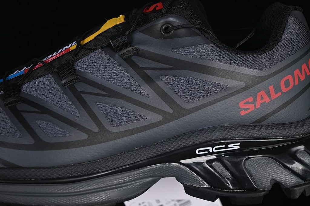 Close-up of the side panels, red branding, and sculpted midsole