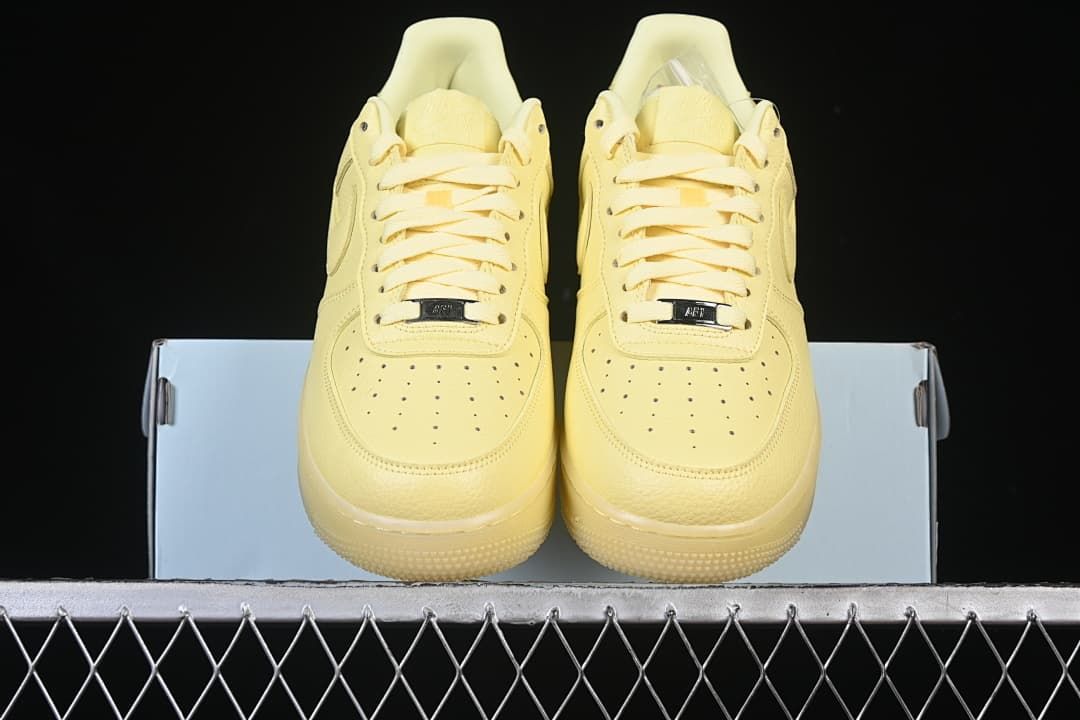 Front view of the pair showing the perforated toes and matching laces