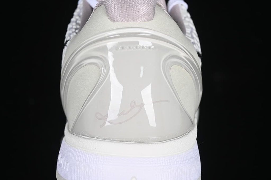 Rear heel detail of the white basketball shoe