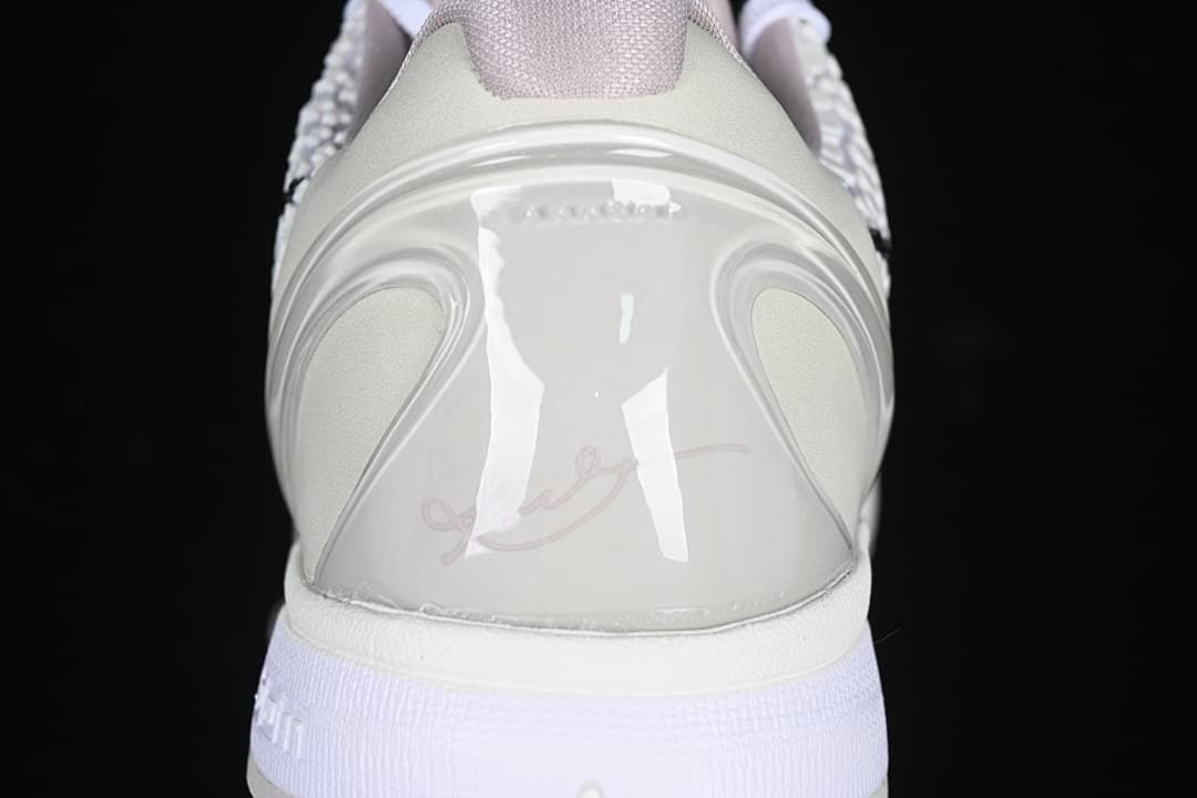 Rear heel detail of the white basketball shoe
