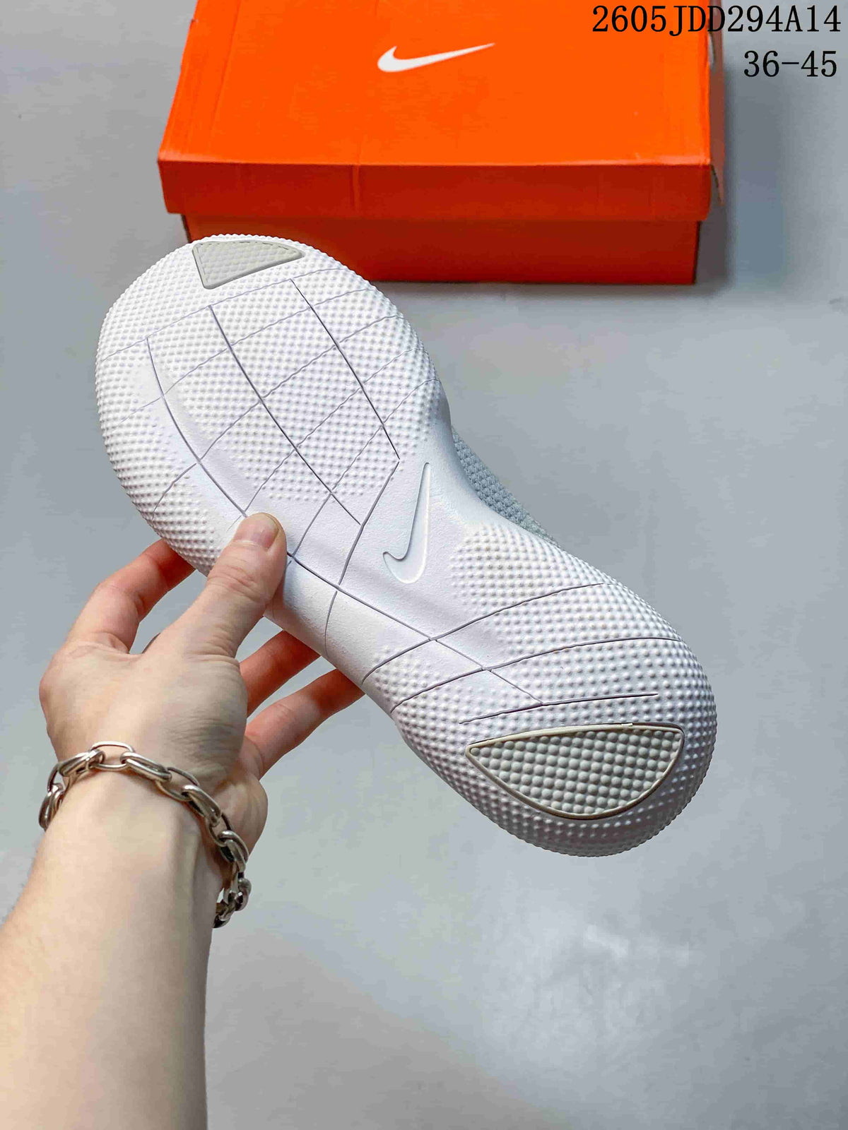 View of the textured, segmented outsole on a light-colored Nike Free shoe