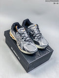 Silver and black ASICS Gel-Nimbus 10.1 sneakers displayed on a shoebox