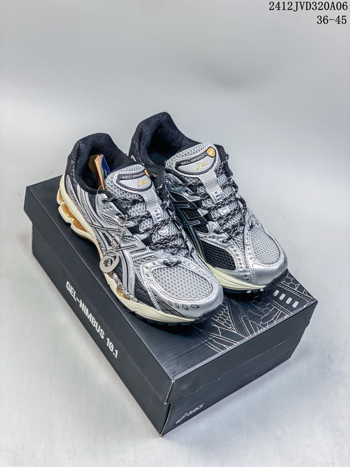 Silver and black ASICS Gel-Nimbus 10.1 sneakers displayed on a shoebox