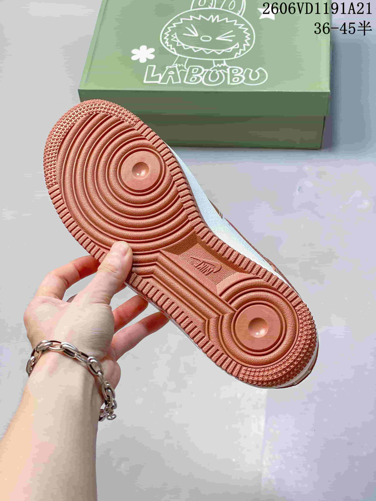 Brown outsole with circular tread pattern on a LABUBU-themed sneaker