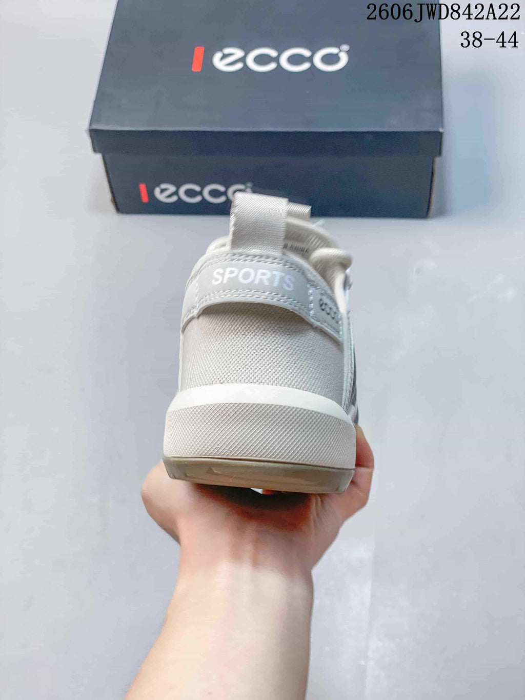 Rear view of the sneaker showing the heel pull tab and mesh construction.