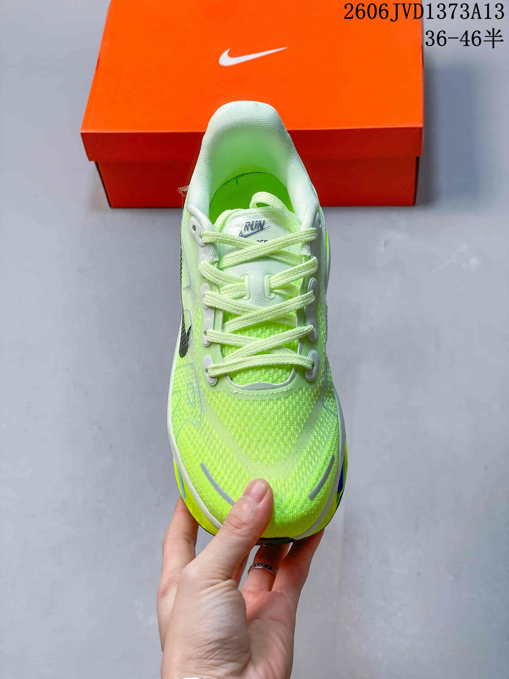 Top view of the fluorescent green Nike Vomero Premium shoe with laces