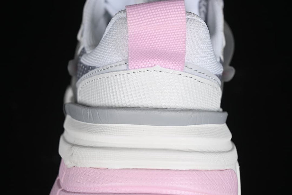 Rear view highlighting the pink heel pull tab and layered sole.